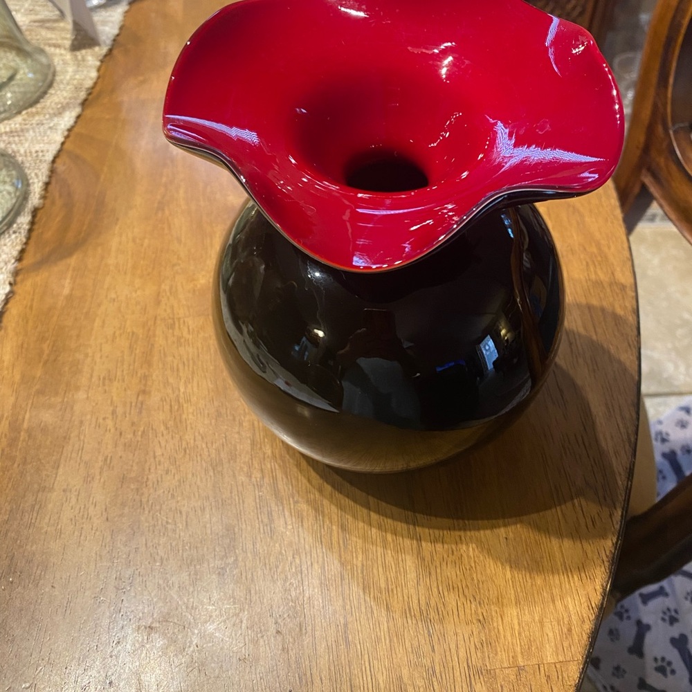 Hand blown black art glass vase with red ruffled rim. Polished pontil. 7.5” x 6”